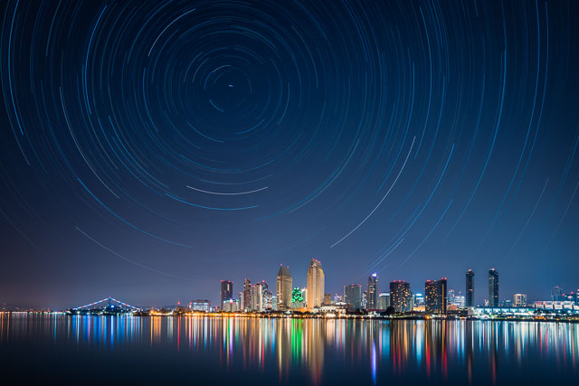 Star trails over the downtown skyline. The view is from Coronado.