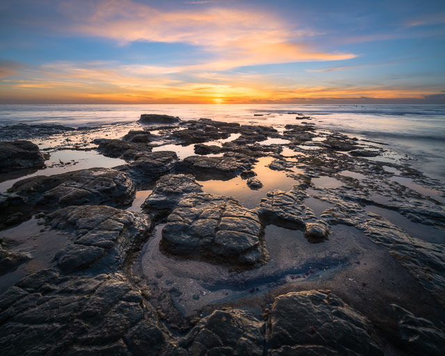 A fractured rock formation at Sunset Cliffs that looks like a puzzle.