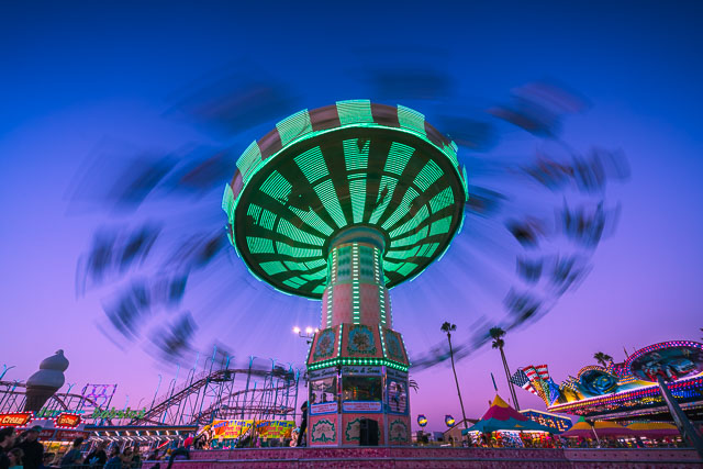 Swing carousel ride at the San Diego Fair. Photo is at twilight.